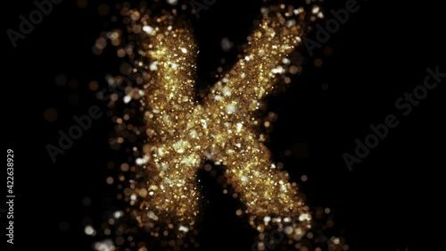 Gold glitter letter K fly into camera. Golden glitter alphabet symbol reveals on black background.