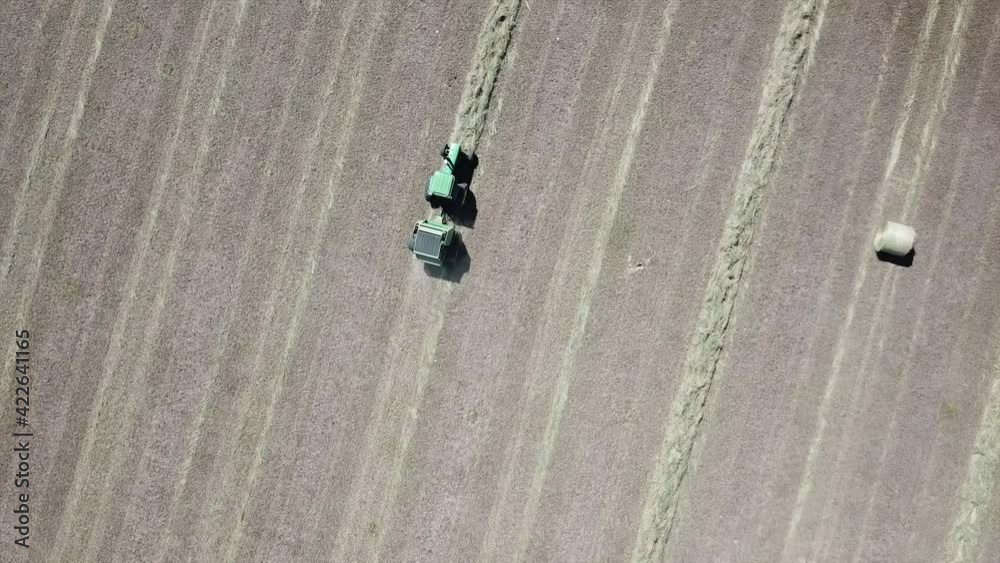 Follow hay bailer in field