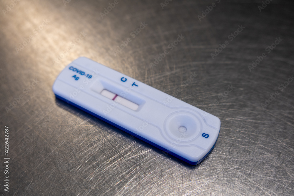 negative Covid test lies on a silver table negative Covid test lies on a silver table