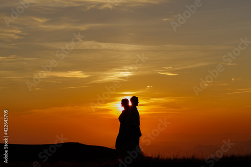 loving couple on a sunset background
