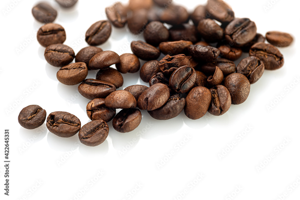Coffee beans scattered randomly on a white background Coffee beans scattered randomly on a white background