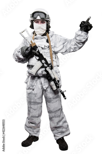 Male in soldier (snow camouflage) uniform with weapon. Shot in studio. Isolated with clipping path on white background