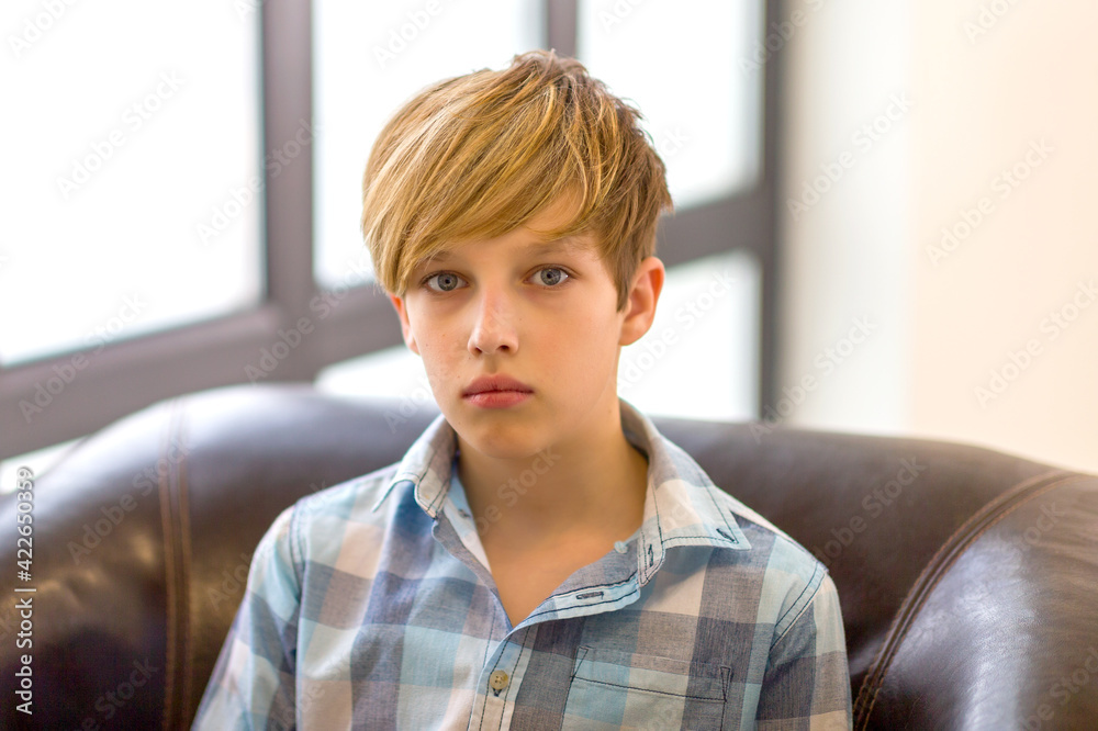 Fototapeta premium Closeup portrait of teenage boy. Photo session in the studio
