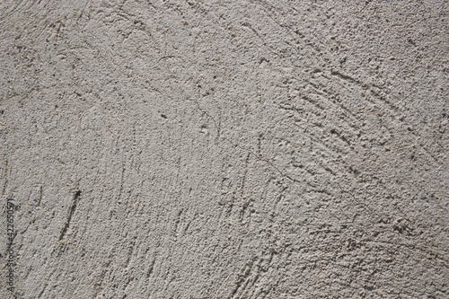 Closeup of a cracked gray concrete wall