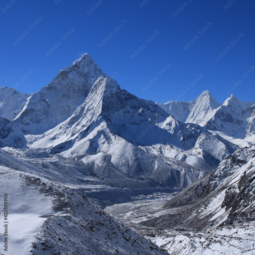Snow covered mountain Ama Dablam on a clear spring morning.