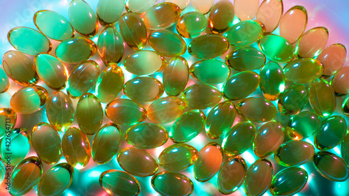 Vitamins gel capsules on ta...