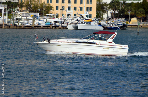 Sport fishing boat on Biscayne Bay with a downtown Miami,Florida marina in the background.