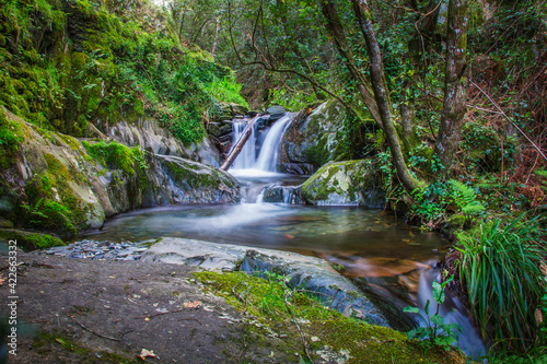 Beautiful forest river with waterfalls at Fraga da Pena, Aldeias de Xisto, Portugal photo