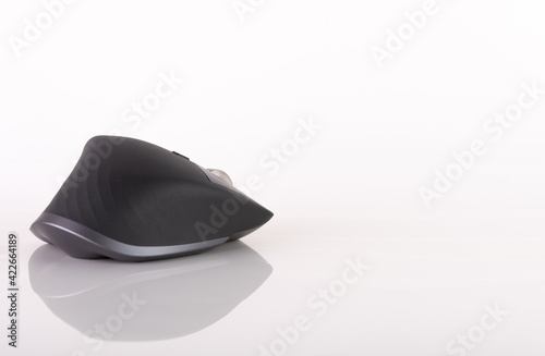 A wireless ergonomical mouse, in white background 