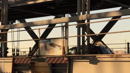 Empire State Building Manhattan skyline view driving across Williamsburg Bridge to Brooklyn New York City NYC