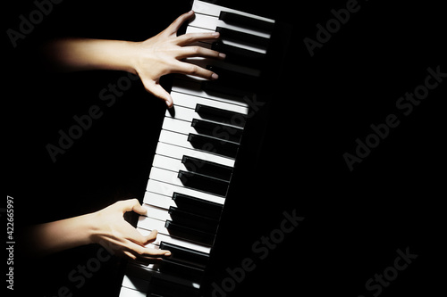 Piano player hands pianist playing keyboard