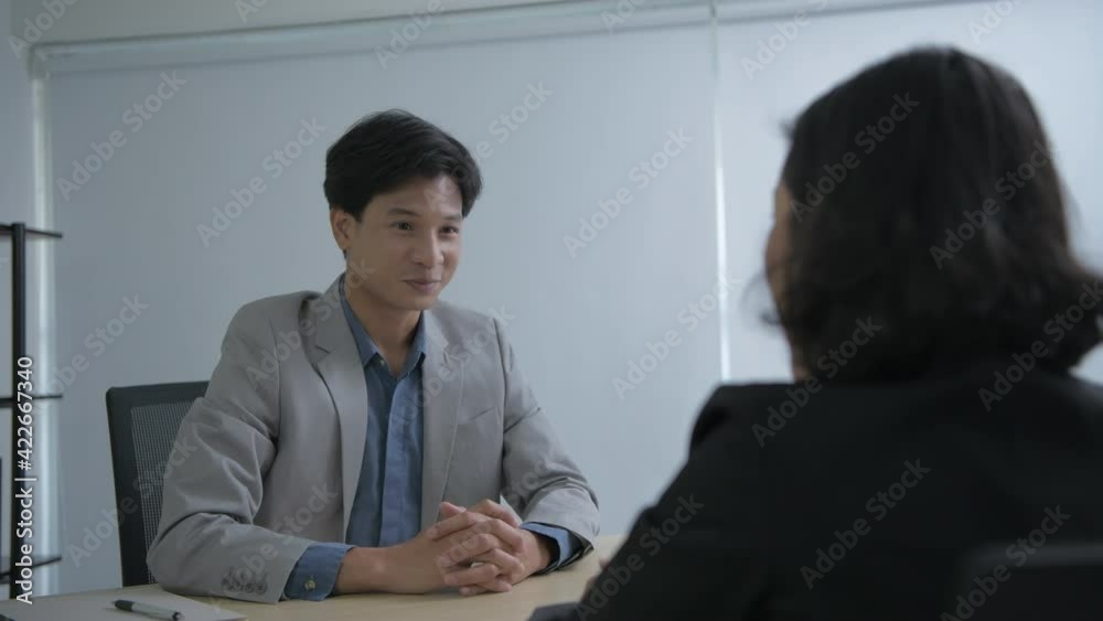 Business concept of 4k Resolution. Asian men are delighted at successful negotiations in office. Business concept of 4k Resolution. Asian men are delighted at successful negotiations in office.