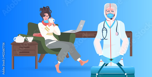 doctor in mask with first aid kit examining woman patient covid-19 pandemic concept