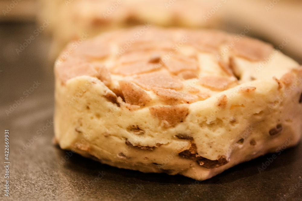 Delicious uncooked cinnamon roll on a pan waiting to be cooked Delicious uncooked cinnamon roll on a pan waiting to be cooked