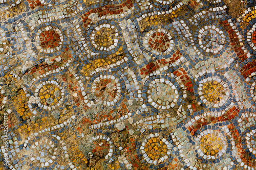 View of remaining colorful mosaic floors at ruins of residential buildings of ancient Greek settlement of Ephesus near Selcuk in Turkey..