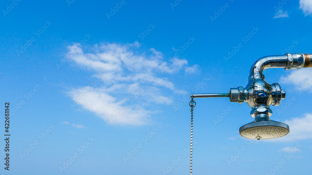 Summer landscape with shower and clear blue sky on the beach Summer landscape with shower and clear blue sky on the beach
