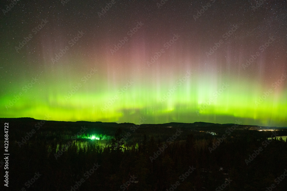 Northern Lights or Aurora Borealis in the Night Sky, Amazing Starry Night Background on Minnesota North Shore