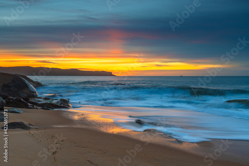 High Cloud Sunrise Seascape with Soft Shades of Colour © Merrillie