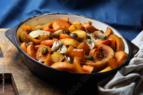 Baked carrots, sweet potatoes, fennel, turnips, chili, pumpkin, garlic and thyme in a cast iron skillet