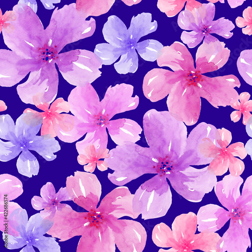 Seamless trendy summer floral pattern with pink watercolor flowers on blue background.