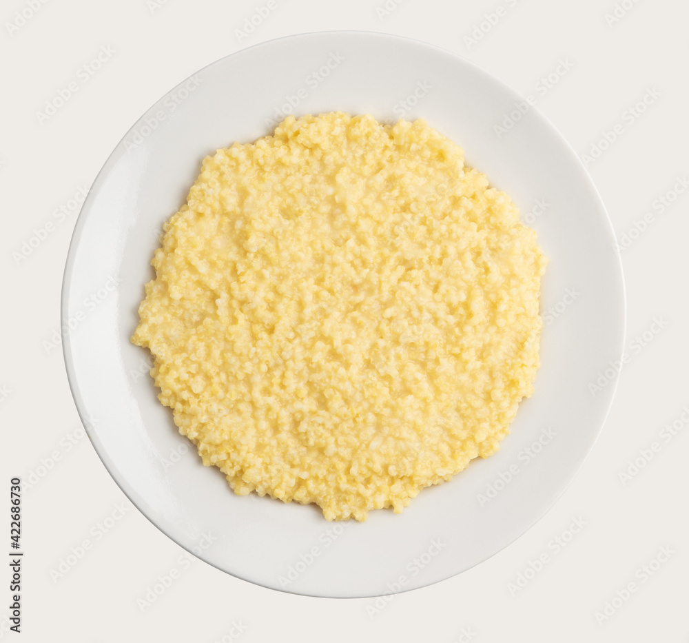 millet bright yellow porridge on an white plate millet bright yellow porridge on an white plate