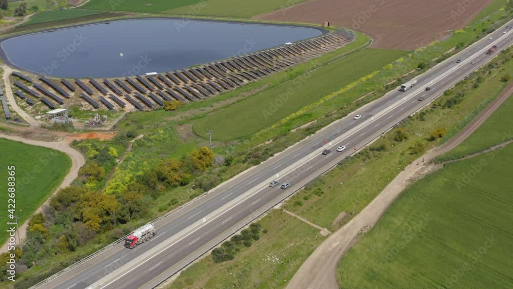 Traffic on a Countryside Highway road surrounded by Agricultural fields, Aerial view.
Traffic on a Countryside Highway road surrounded by Agricultural fields, Aerial view.