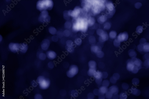 Dark bluebokeh,Dark blue background,Blurred nature bokeh for the background photo