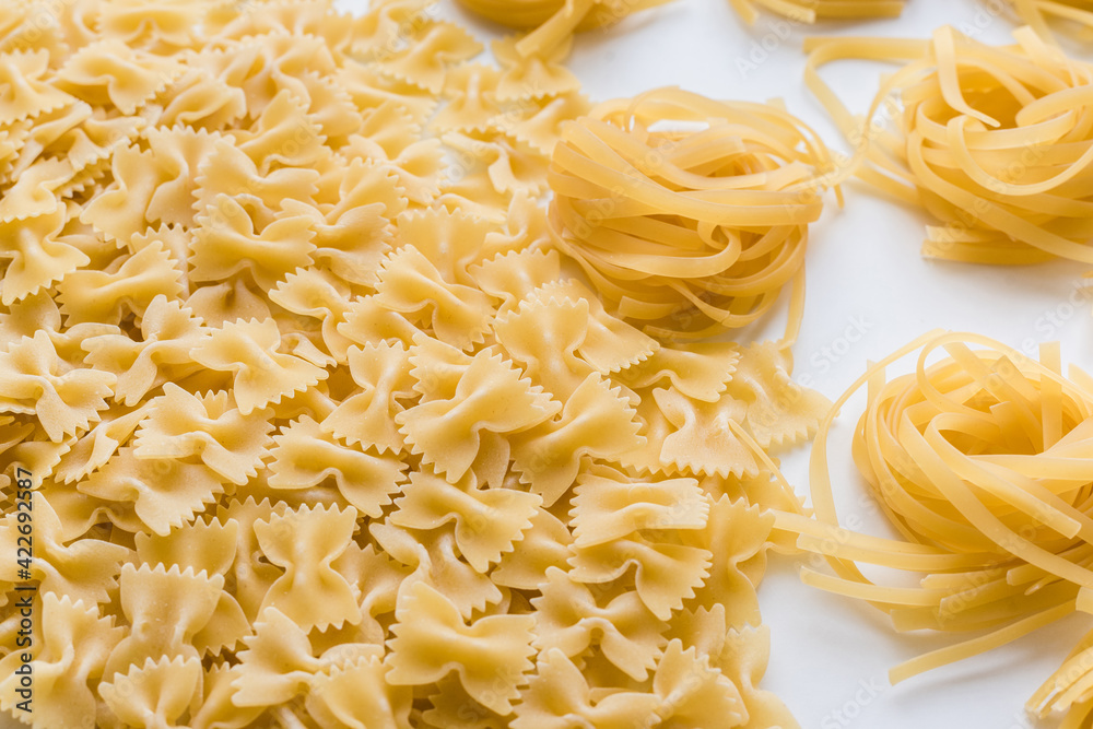 pasta on a white plate, raw pasta, spaghetti on a white plate 