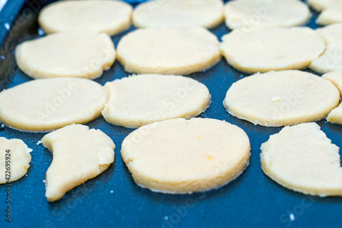 homemade cakes cheese cookies before baking on a baking sheet