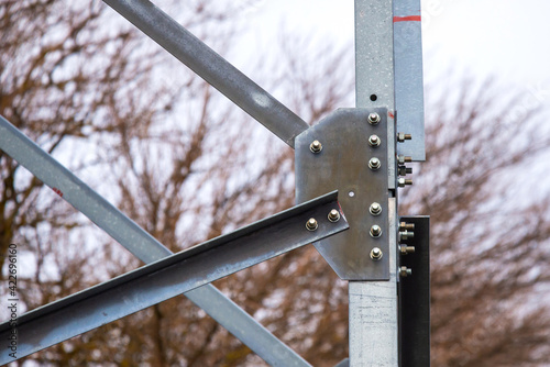 Close-up of a iron bridge or construction with bolts and nuts photo