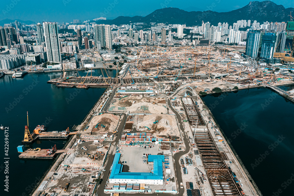 Obraz premium Top view at large construction sites and many cranes are working in the, Industry new building business.