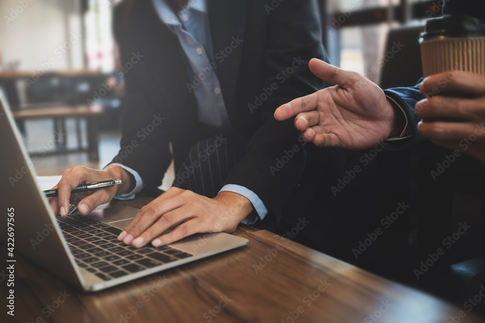 Group of businessmen is discussing in the office about the company profit figures.. Group of businessmen is discussing in the office about the company profit figures..