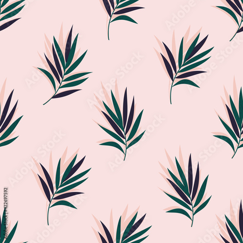 A vector seamless tropical green abstract pattern with palm leaves on light pink background