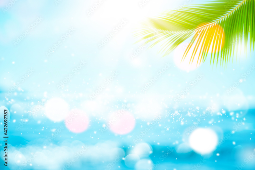 Blur beautiful nature green palm leaf on tropical beach with bokeh sun light wave abstract background. Blur beautiful nature green palm leaf on tropical beach with bokeh sun light wave abstract background.