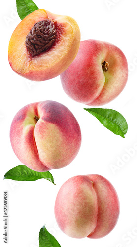 peach slices and leaves flying on white background