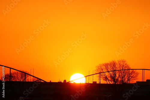 Sunrise through a bridge over the river. photo