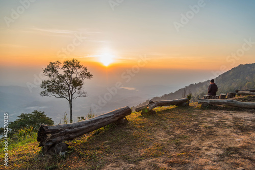 Phetchabun THAILAND -    December    13     2020  A man sitting in the sunset