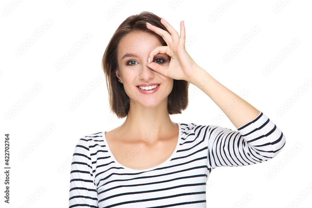 Beautiful young woman showing gesture OK on white background Beautiful young woman showing gesture OK on white background