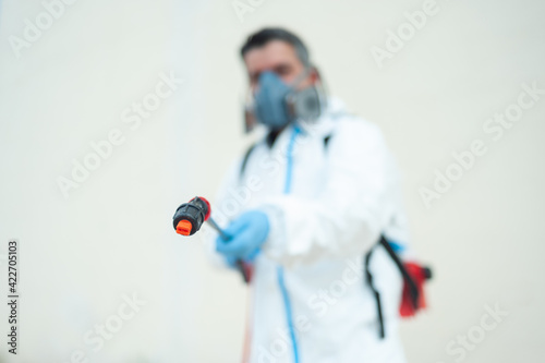 Fumigator sanitizing, cleaning and disinfection. Coronavirus pandemic professional control.