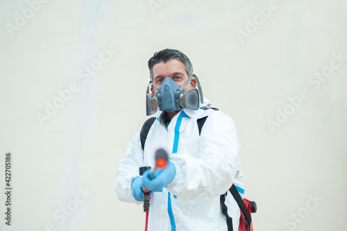 Fumigator sanitizing, cleaning and disinfection. Coronavirus pandemic professional control.