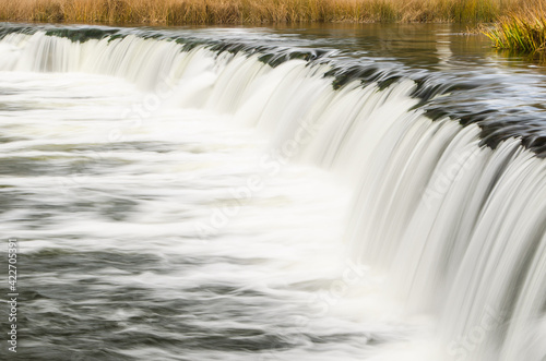 Venta waterfall, the widest waterfall in Europe, long exposure photo, Kuldiga, Latvia © Bargais