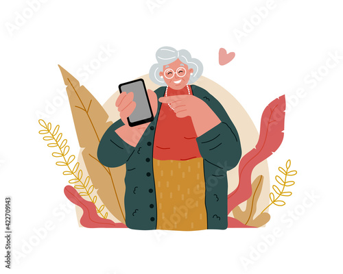 An elderly grandmother is holding a cell phone.Senior people using smart devices.