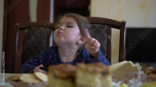 Don't do, this is mistake! Little Girl warning with admonishing finger gesture, saying no, be careful, scolding and giving advice to avoid danger, disapproval sign