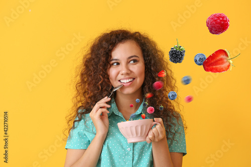 Young woman with tasty yogu...