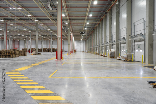 footpath in the warehouse. Wide shot of industrial hall empty and clean. unloading area. nobody.