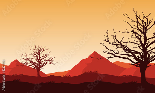 Aesthetic views of the mountains and dry trees in the evening dusk. Vector illustration