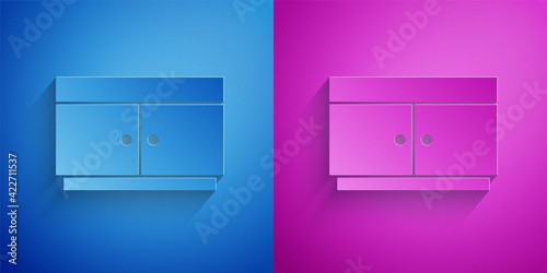 Paper cut Chest of drawers icon isolated on blue and purple background. Paper art style. Vector