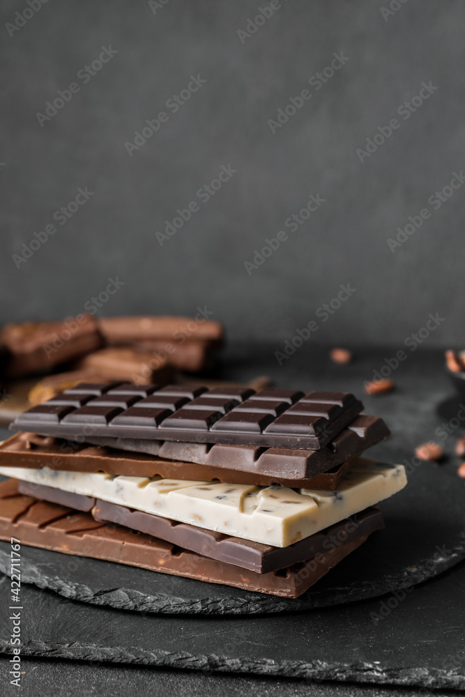 Different chocolate bars on dark background Different chocolate bars on dark background