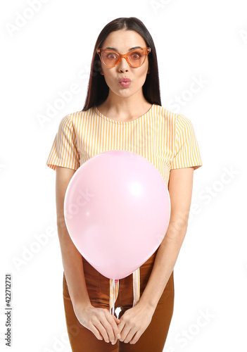 Funny young woman with ball...