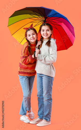 Portrait of cute twin girls...